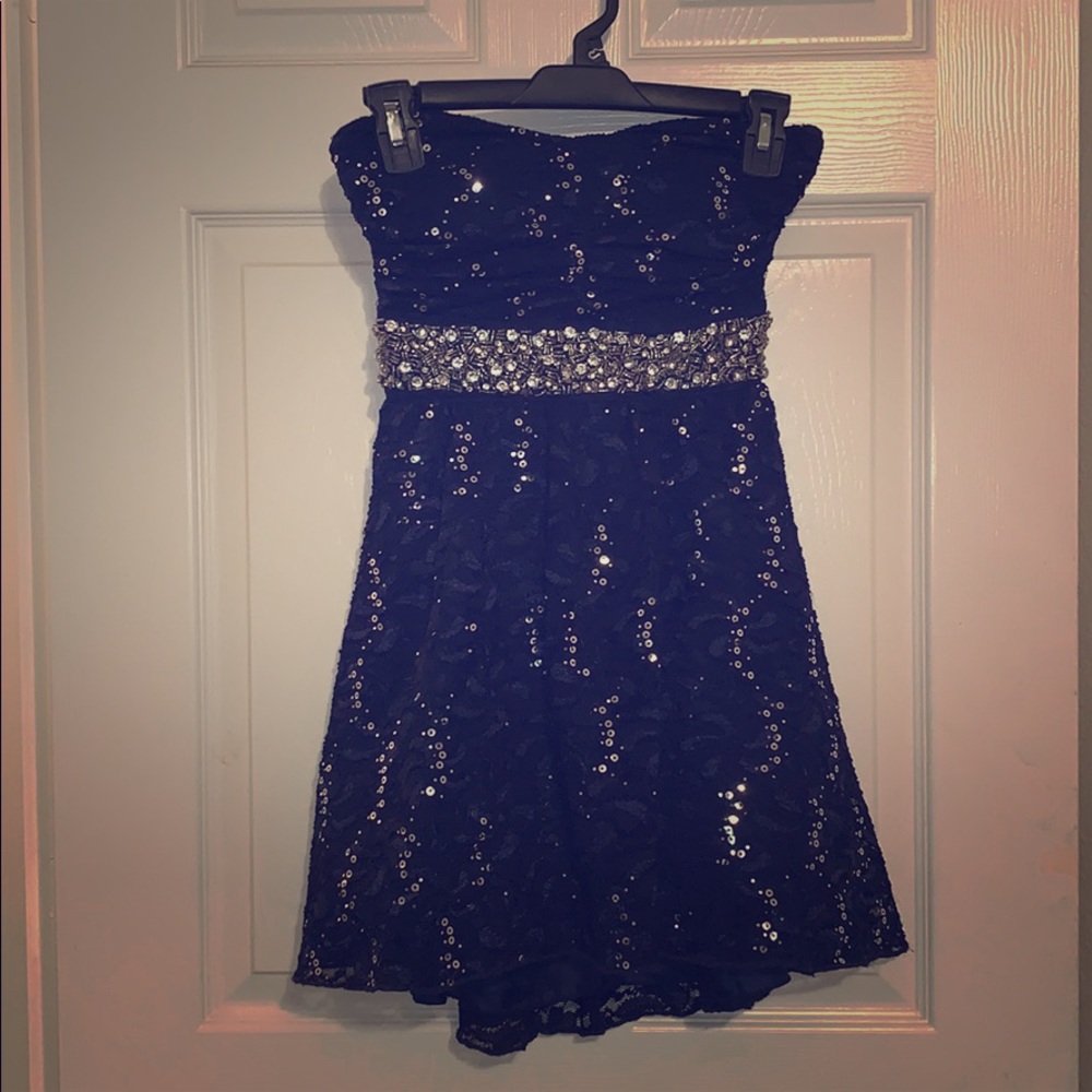 Navy blue strapless dress with sequin details.